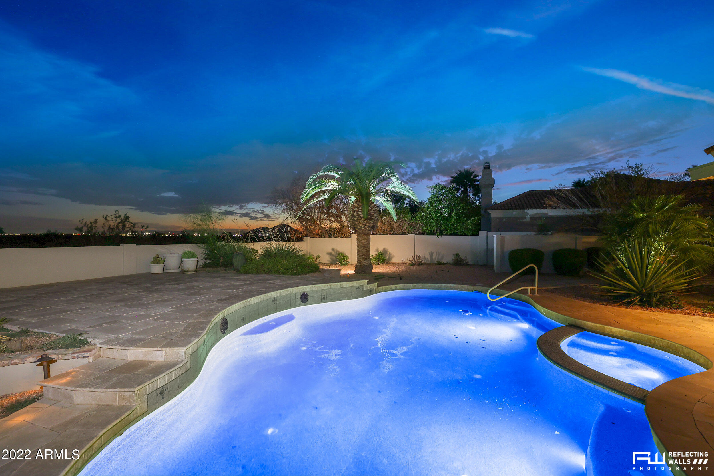 10085 East Doubletree Ranch Road Scottsdale, AZ 85258 - Photo 52 of 62 a view of a swimming pool with a table and chairs