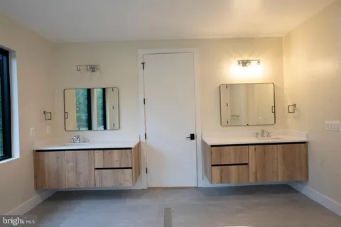 a white bath tub sitting in a bathroom