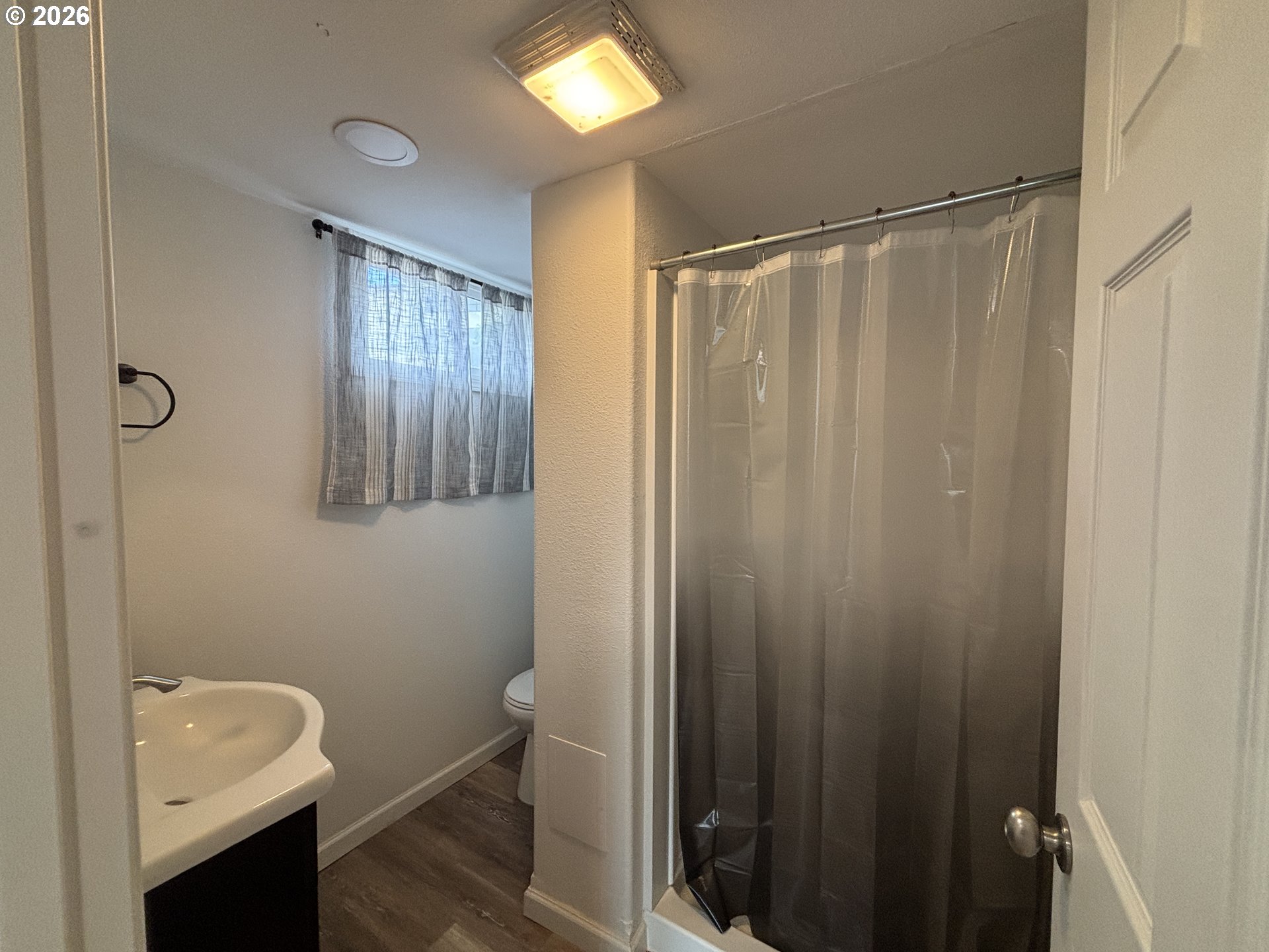 924 Southwest 33rd Street Pendleton, OR 97801 - Photo 18 of 27 a bathroom with a shower a toilet and sink