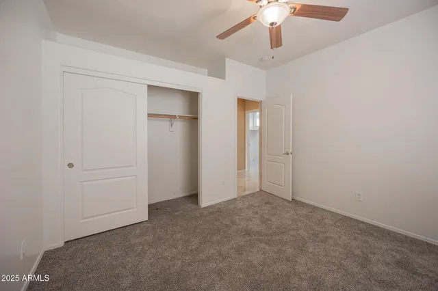 an empty room with fan