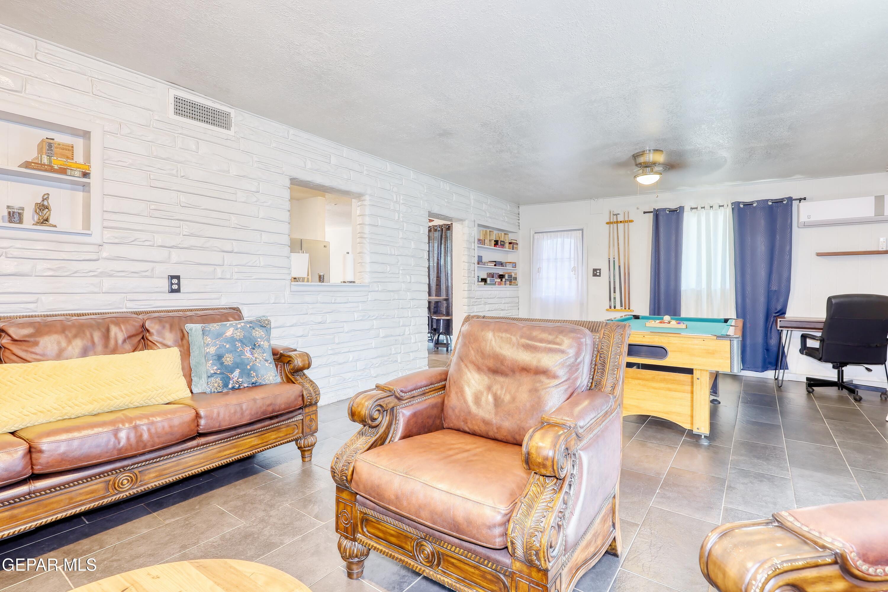 5912 Delta Drive El Paso, TX 79905 - Photo 16 of 37 a living room with furniture and a couch