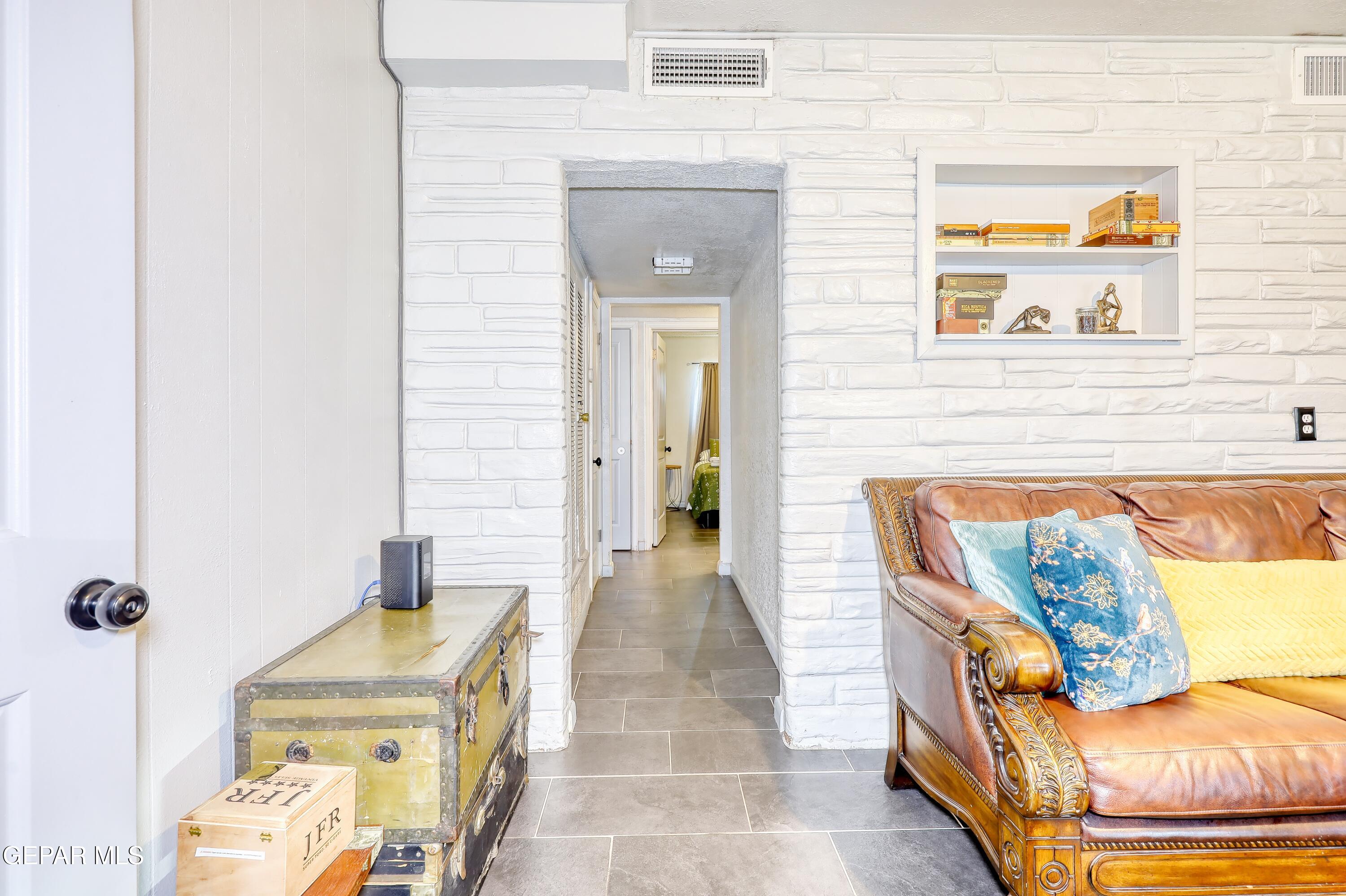 5912 Delta Drive El Paso, TX 79905 - Photo 17 of 37 a view of a bedroom with furniture and wooden floor