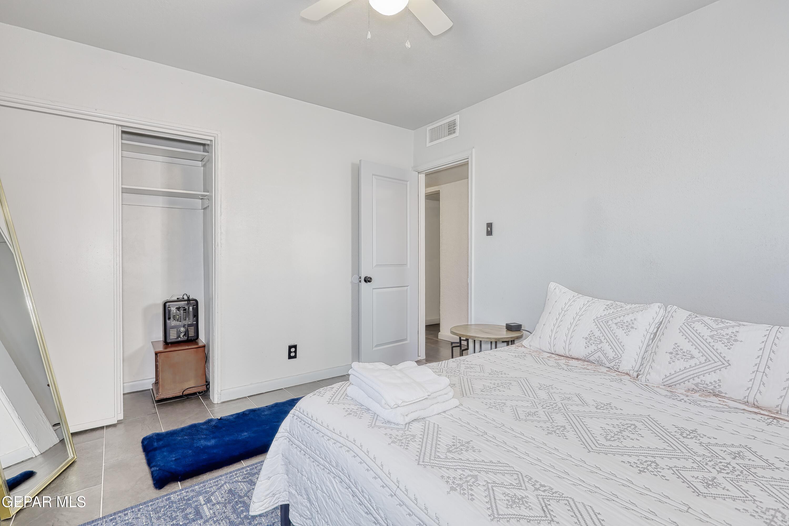 5912 Delta Drive El Paso, TX 79905 - Photo 29 of 37 a bedroom with a bed and wooden floor