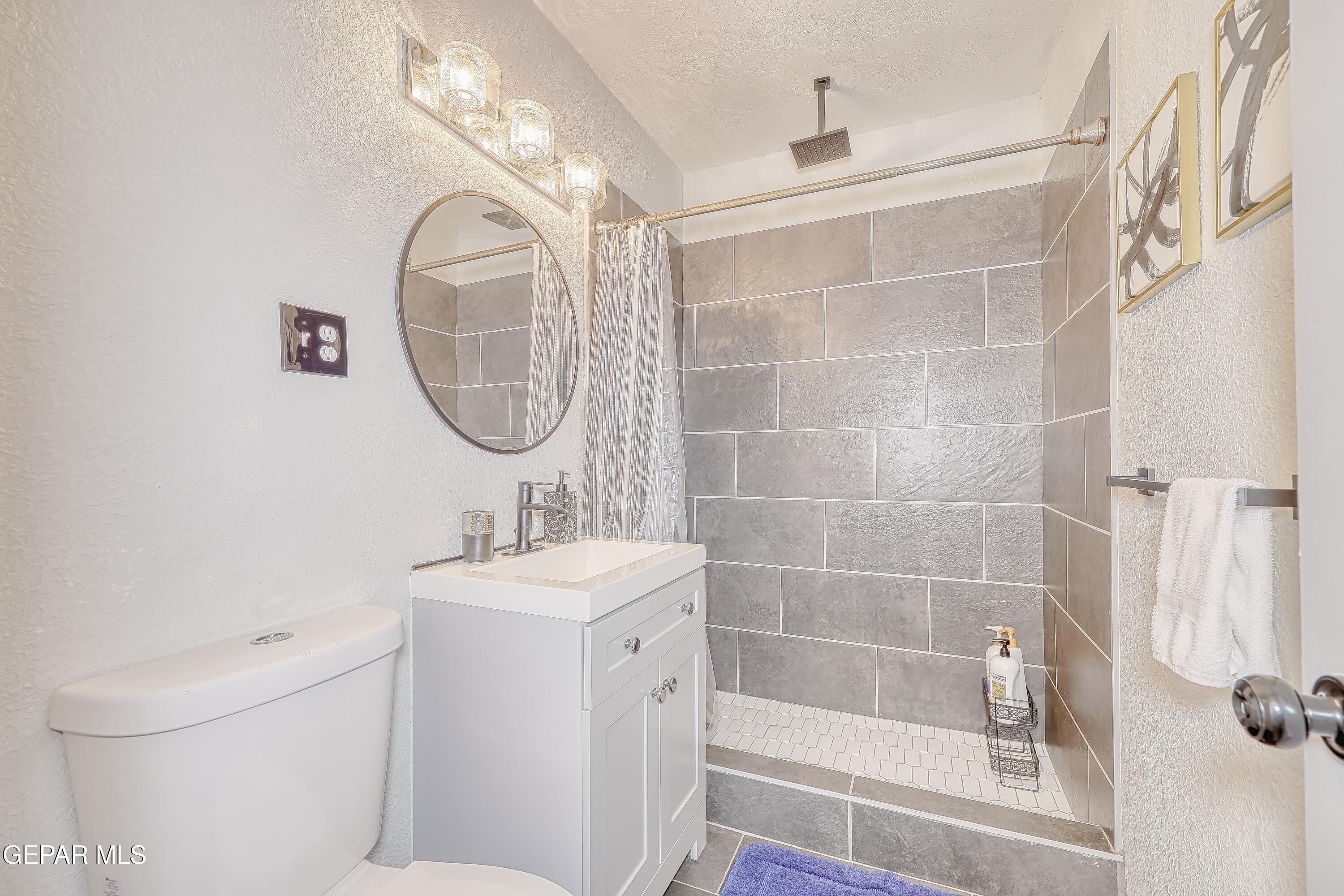 5912 Delta Drive El Paso, TX 79905 - Photo 33 of 37 a bathroom with a sink toilet and shower