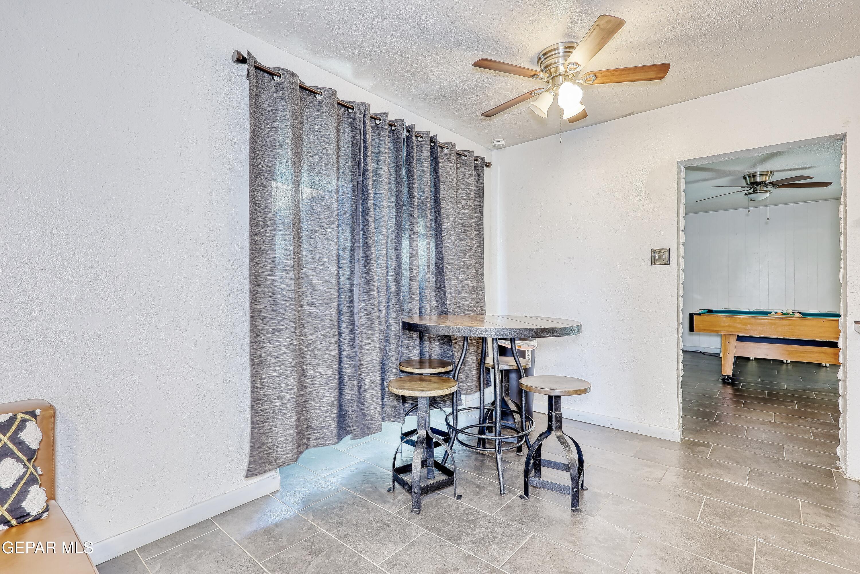 5912 Delta Drive El Paso, TX 79905 - Photo 5 of 37 a view of a workspace with furniture and a window