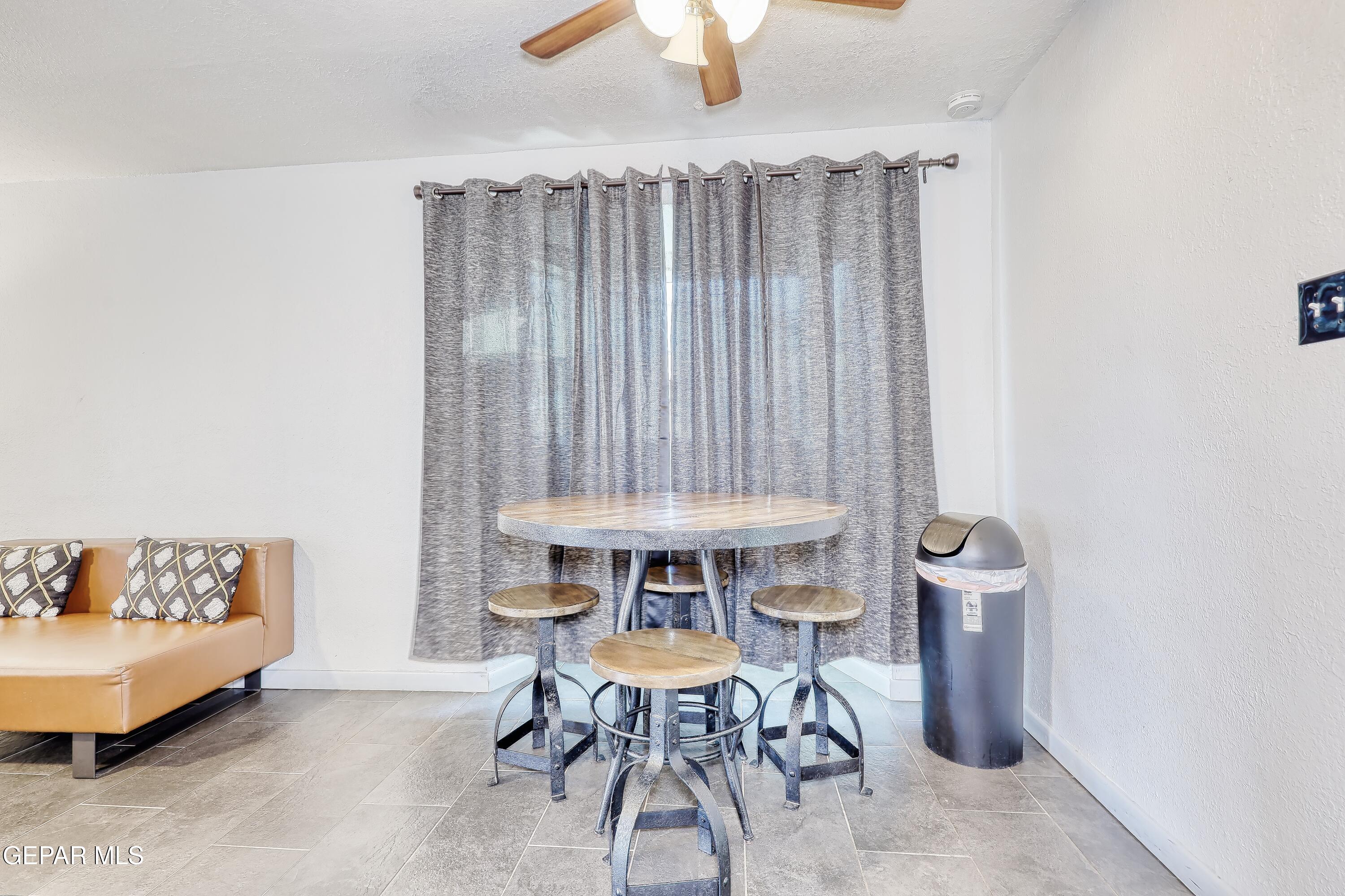 5912 Delta Drive El Paso, TX 79905 - Photo 6 of 37 a view of a dining room with furniture and chandelier