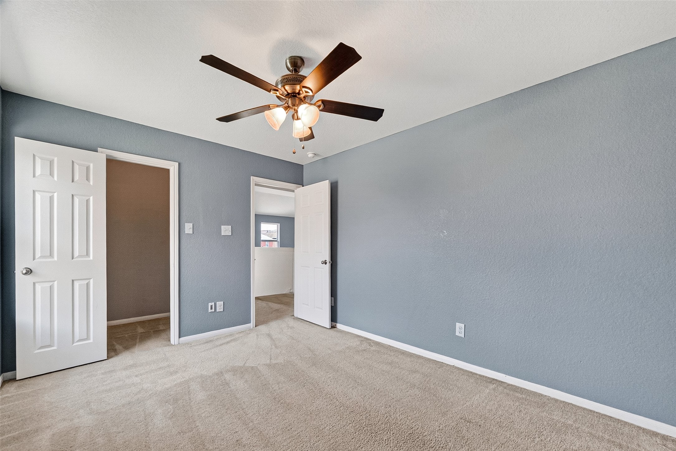 2702 Modano Court Fresno, TX 77545 - Photo 29 of 46 an empty room with closet and a chandelier fan