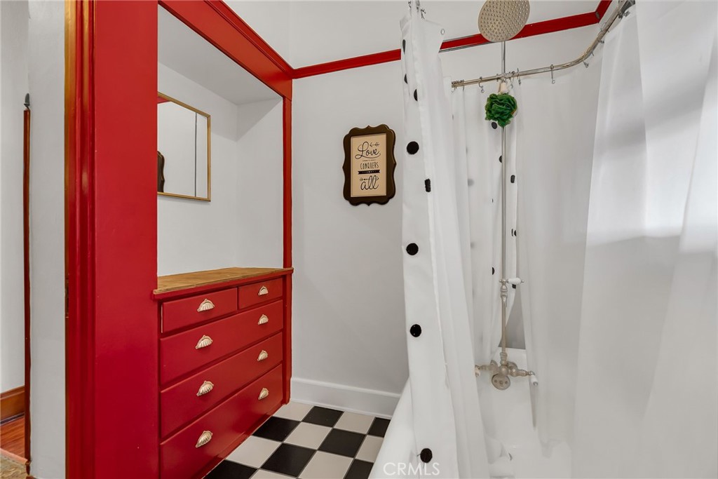 4450 4th Street Riverside, CA 92501 - Photo 22 of 43 a bathroom with a bathtub and shower