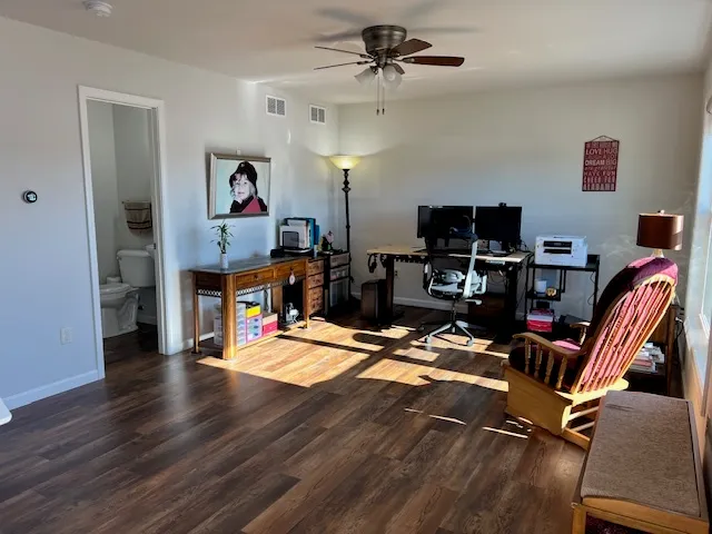 a view of a workspace with furniture and a workspace