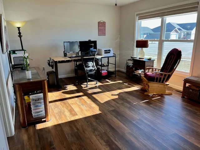a workspace with furniture hardwood and a window