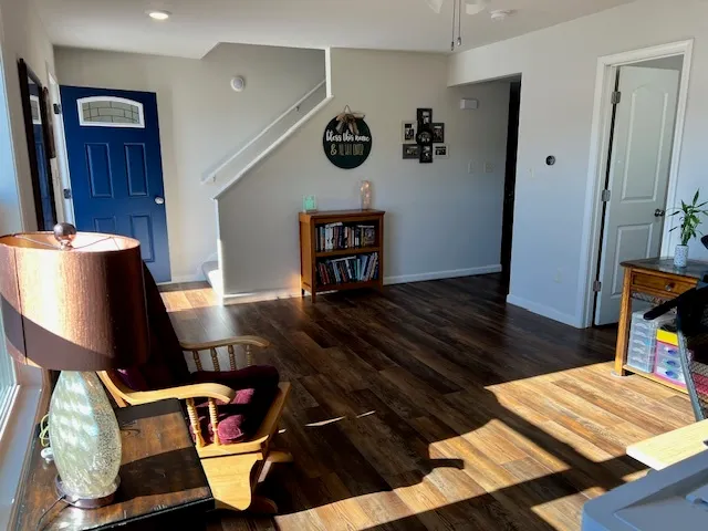 a view of workspace with furniture and wooden floor