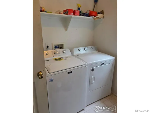 a bed sitting in a room next to a window