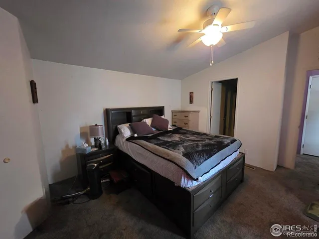a room with a table chairs and wooden floor
