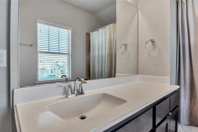 a bathroom with a tub and a sink