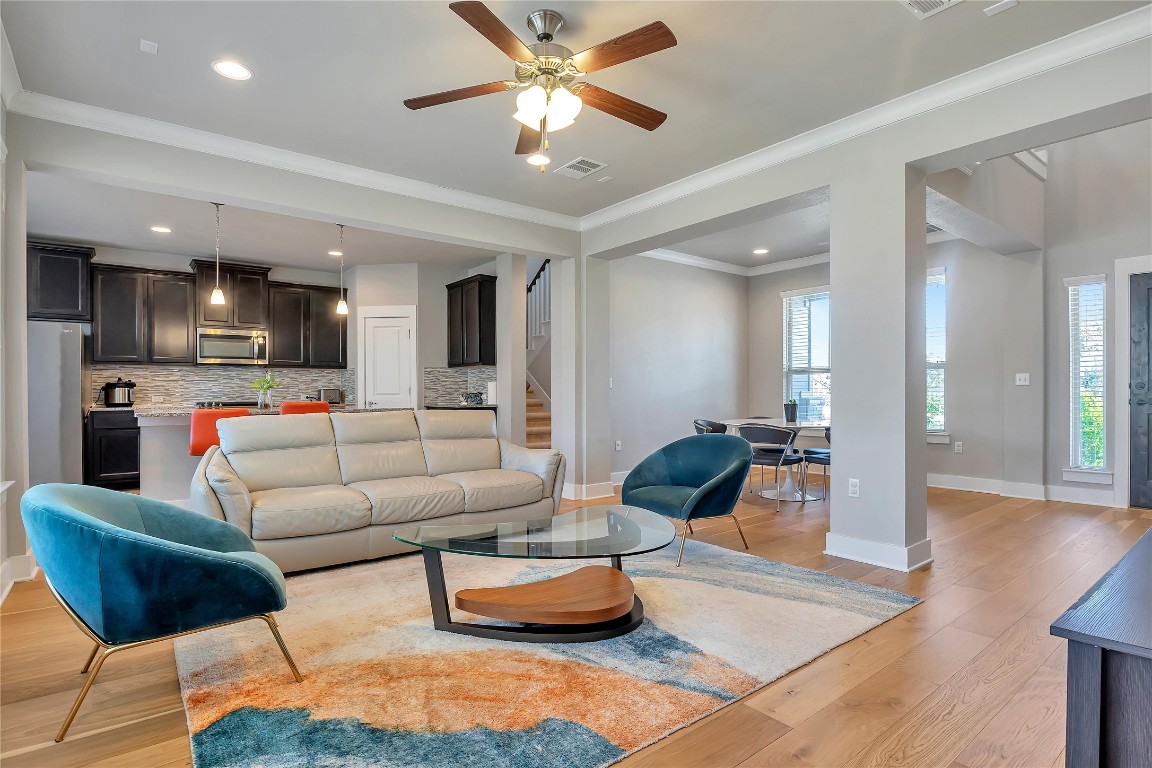 9302 McKnight Loop, Unit 43 Austin, TX 78717 - Photo 3 of 24 a living room with furniture and kitchen view