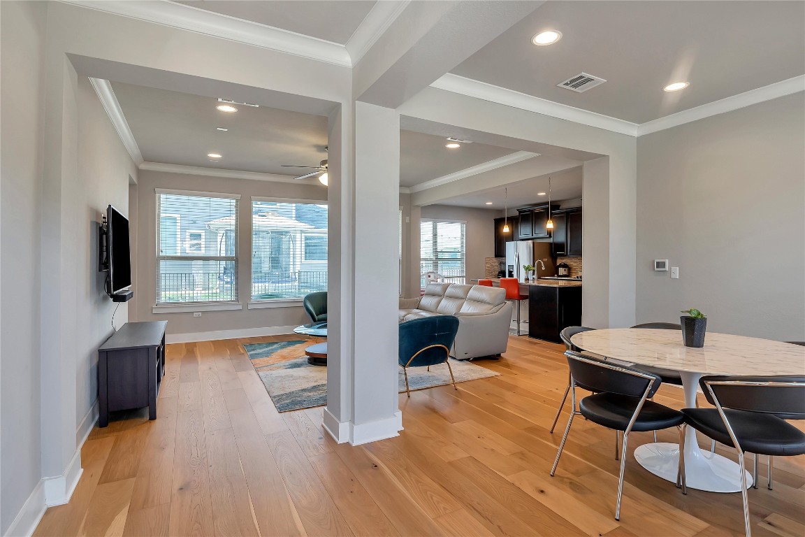 9302 McKnight Loop, Unit 43 Austin, TX 78717 - Photo 9 of 24 a dining room with wooden floor and furniture