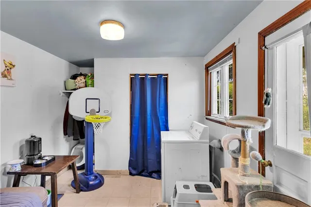 a view of hall way with furniture