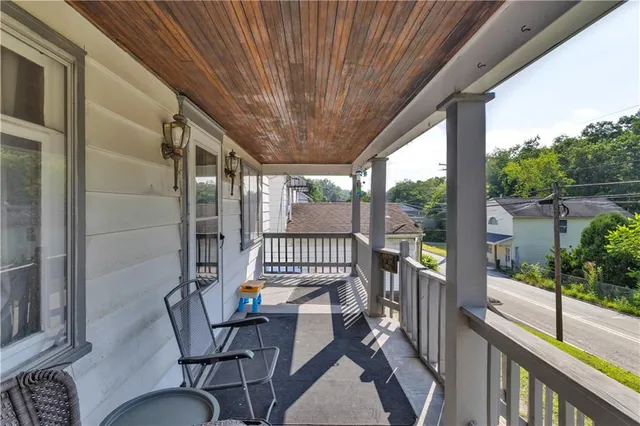 a view of a porch with furniture