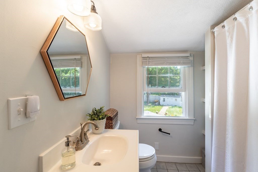 2 Ross Road Topsfield, MA 01983 - Photo 25 of 36 a bathroom with a toilet sink and mirror