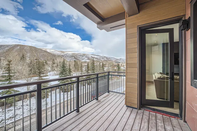 a view of a balcony with wooden floor