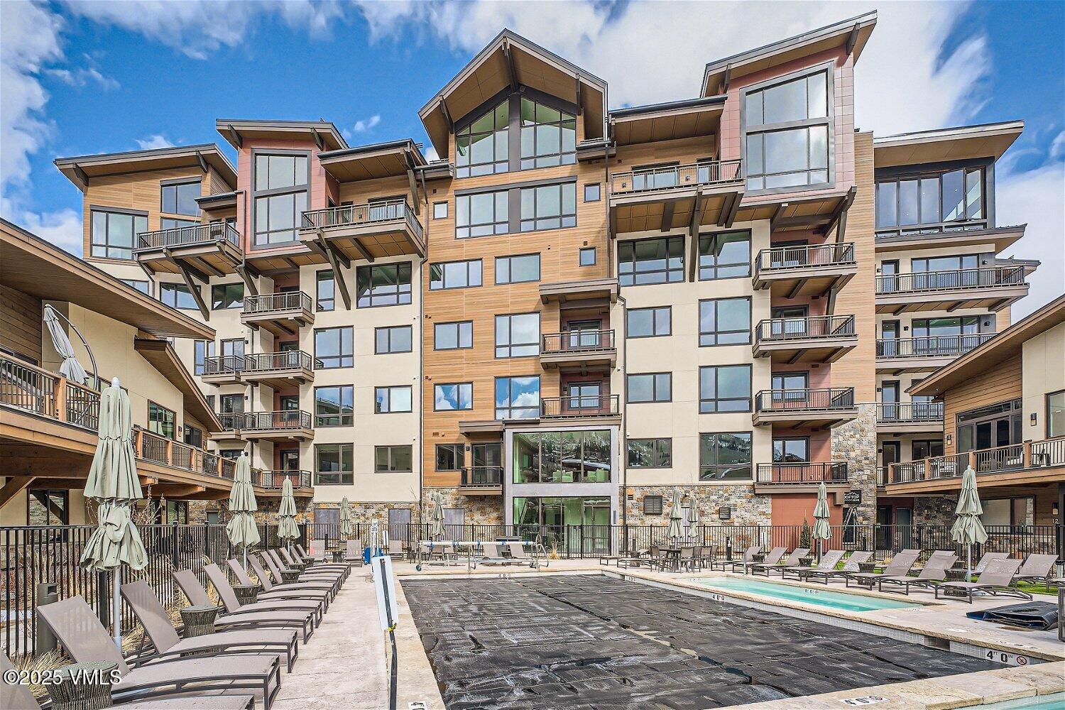 42 Riverfront Lane, Unit 205 Avon, CO 81620 - Photo 12 of 20 a front view of a building with a street