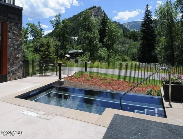 a view of outdoor space with swimming pool and furniture