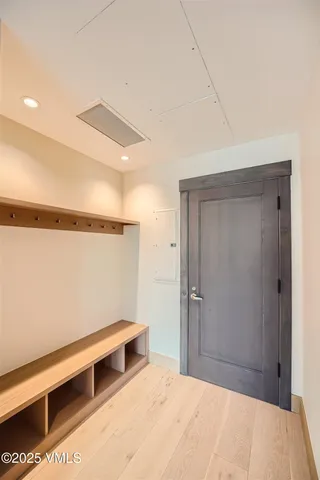 a bedroom with a bed and a ceiling fan