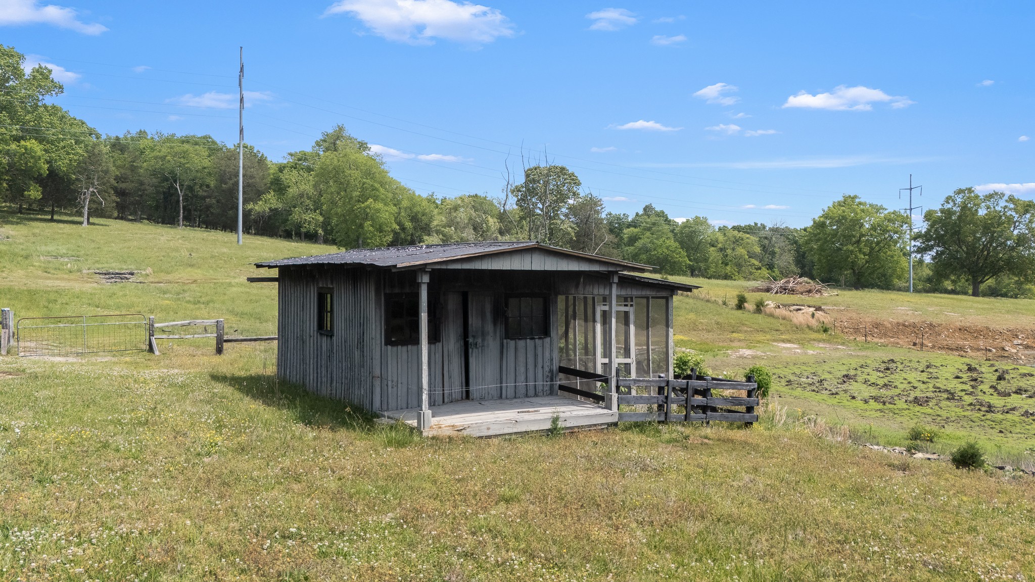 32 Grisham Road Fayetteville, TN 37334 - Photo 6 of 15 a view of a wooden house with a yard