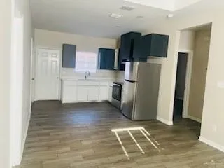 a kitchen with stainless steel appliances a refrigerator and a sink