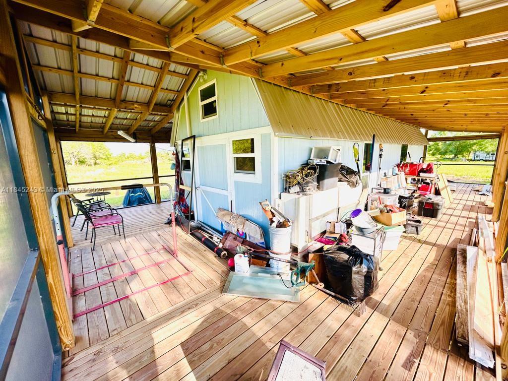 6588 4th Road LaBelle, FL 33935 - Photo 11 of 16 a view of a tables and chairs in the patio