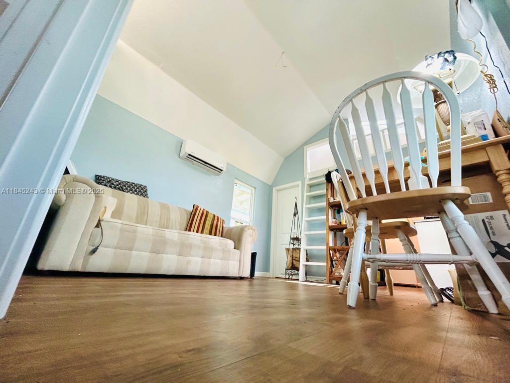 6588 4th Road LaBelle, FL 33935 - Photo 7 of 16 a view of an entryway with wooden floor