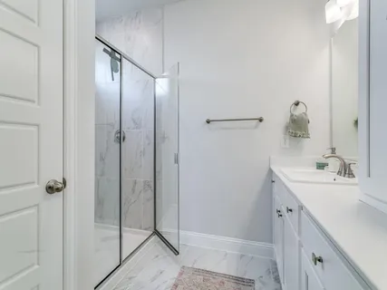 a bathroom with a double vanity sink and mirror