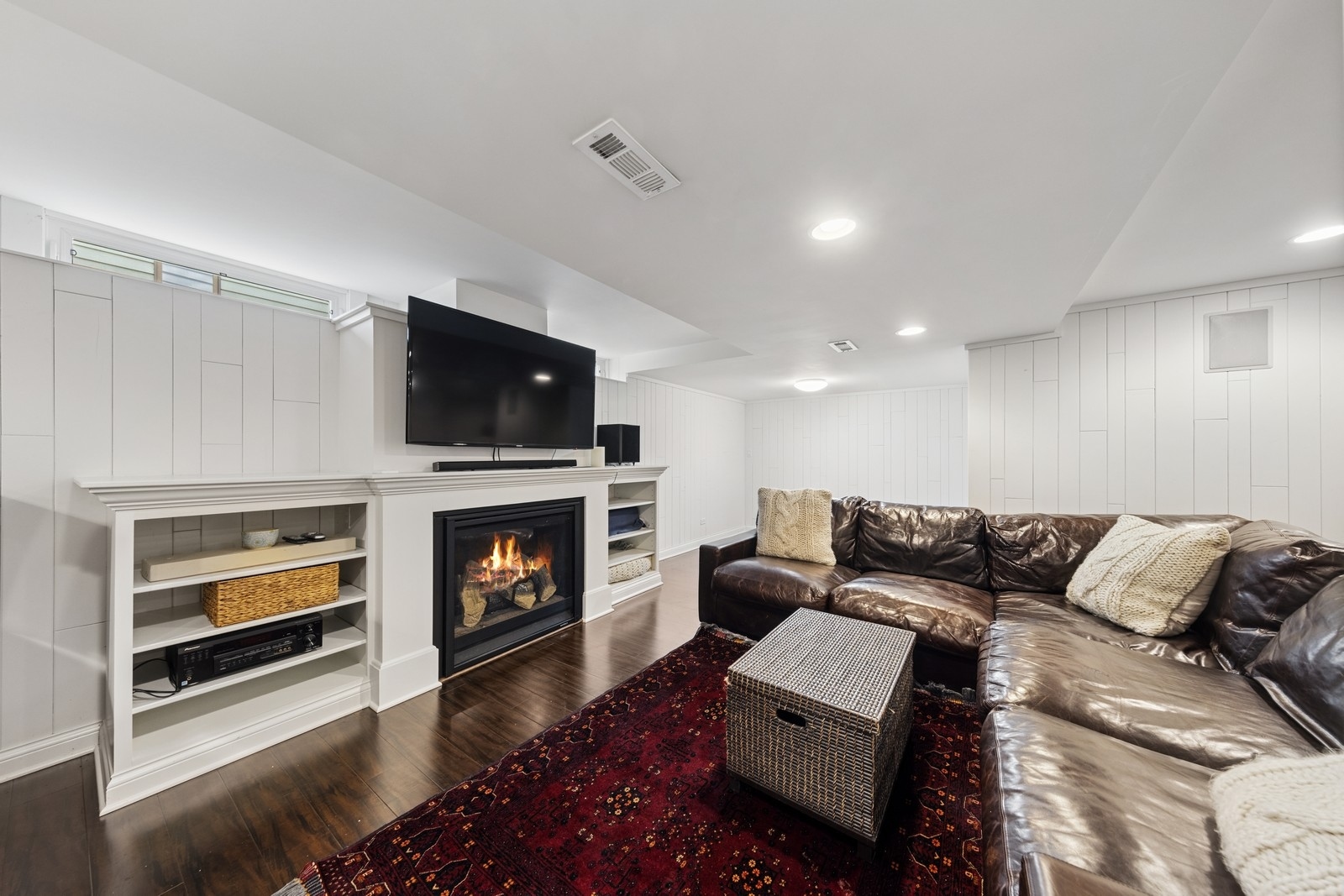 216 Bonnie Brae Hinsdale, IL 60521 - Photo 24 of 32 a living room with furniture a fireplace and a flat screen tv