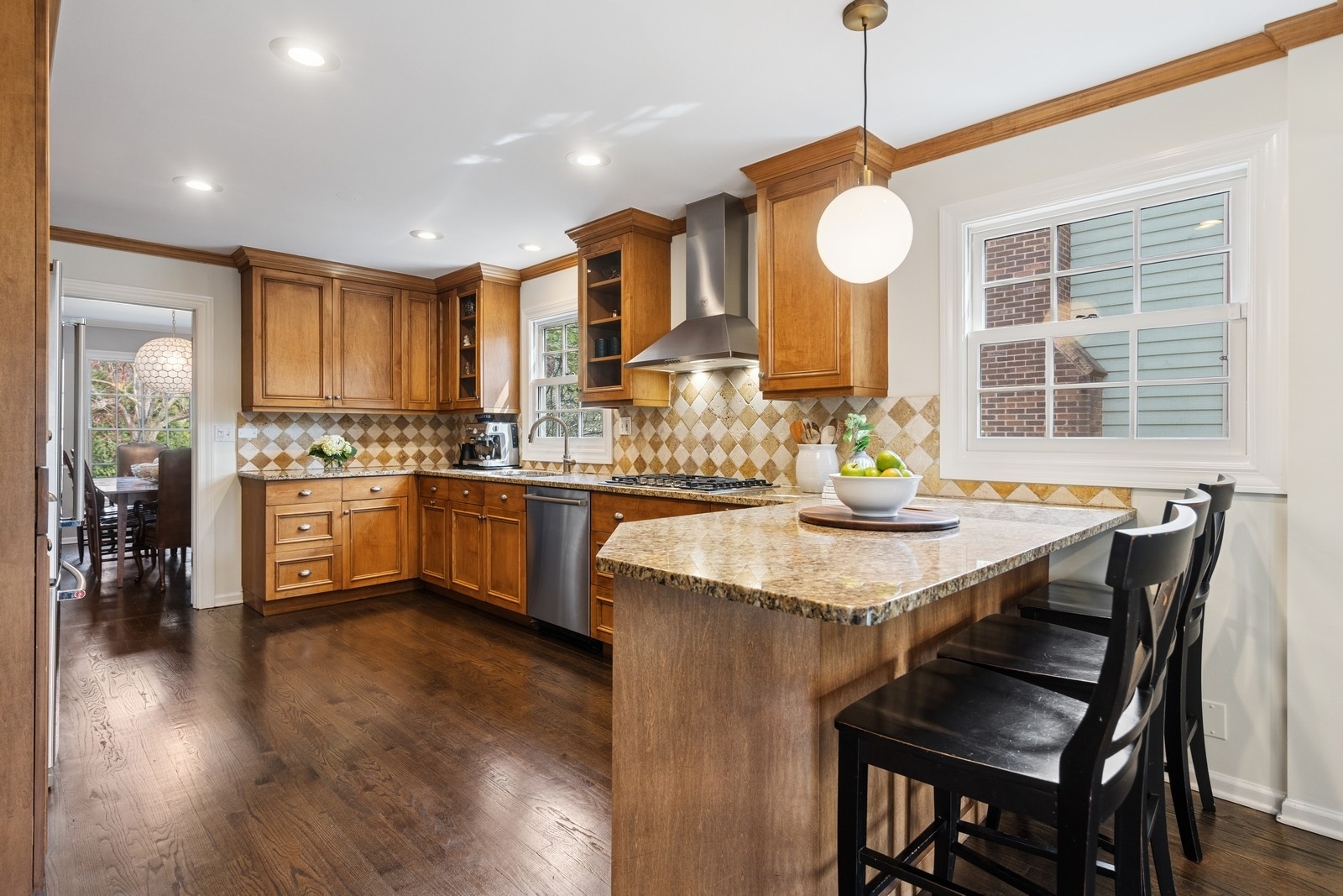 216 Bonnie Brae Hinsdale, IL 60521 - Photo 7 of 32 a kitchen with stainless steel appliances granite countertop a stove top oven a refrigerator a sink and dishwasher with wooden floor