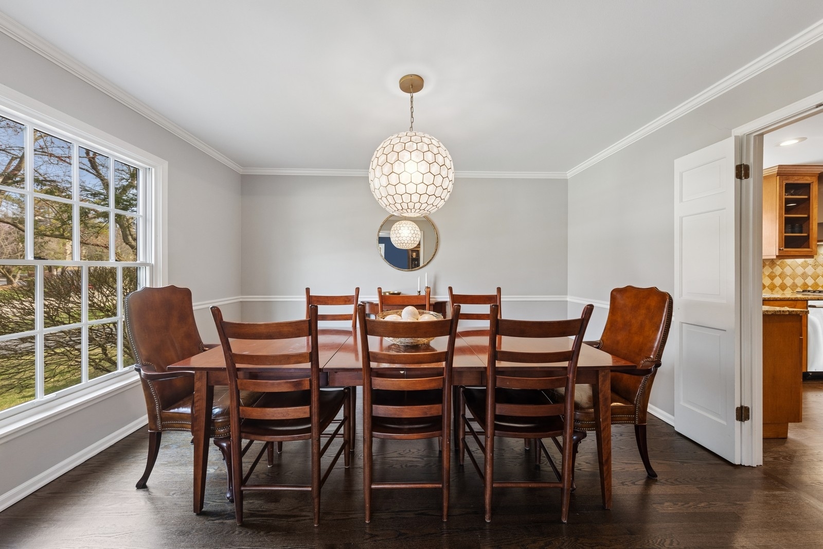 216 Bonnie Brae Hinsdale, IL 60521 - Photo 10 of 32 a dining room with furniture a large window and wooden floor