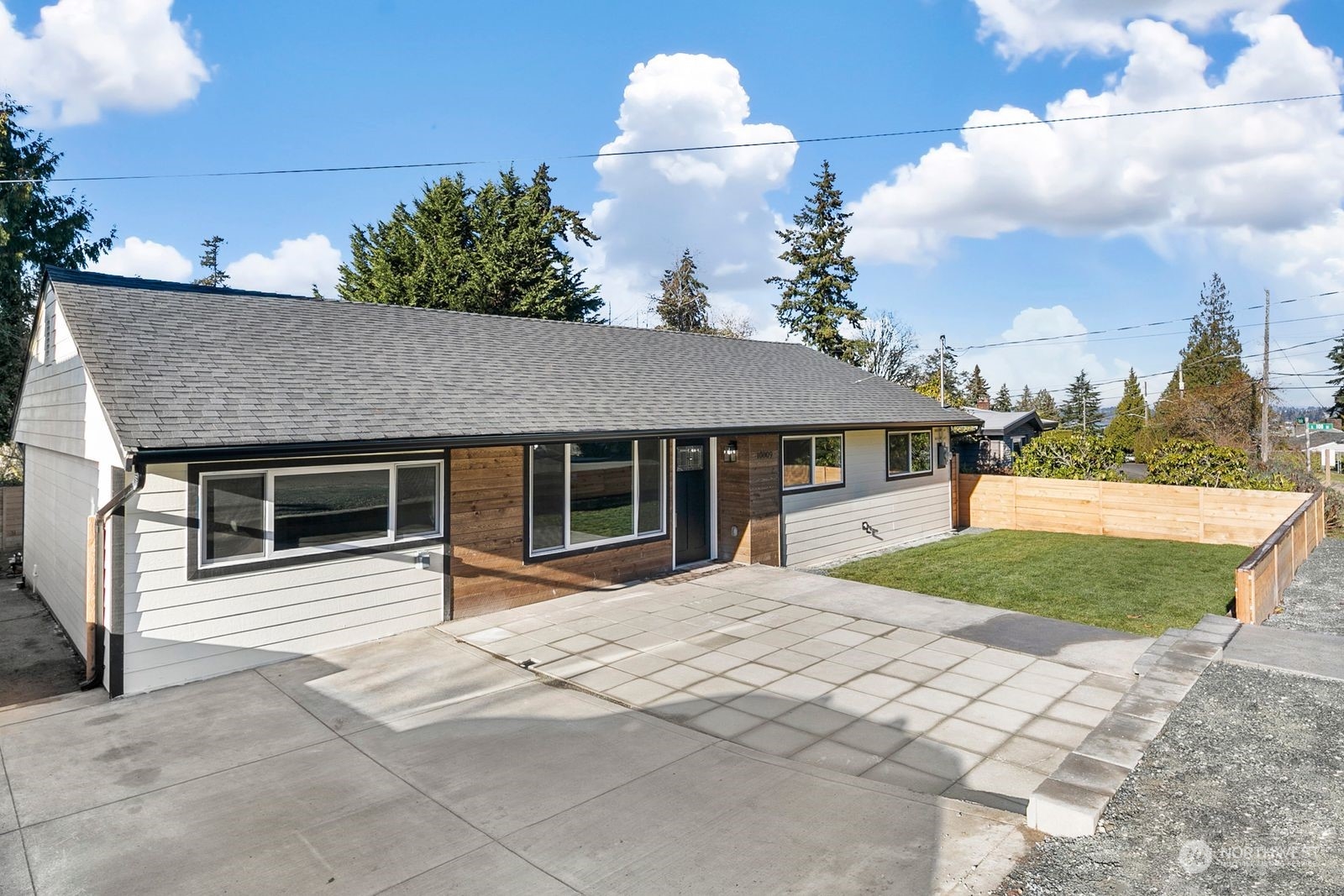 10809 Rustic Road South Seattle, WA 98178 - Photo 1 of 30 a front view of a house with a yard and garage
