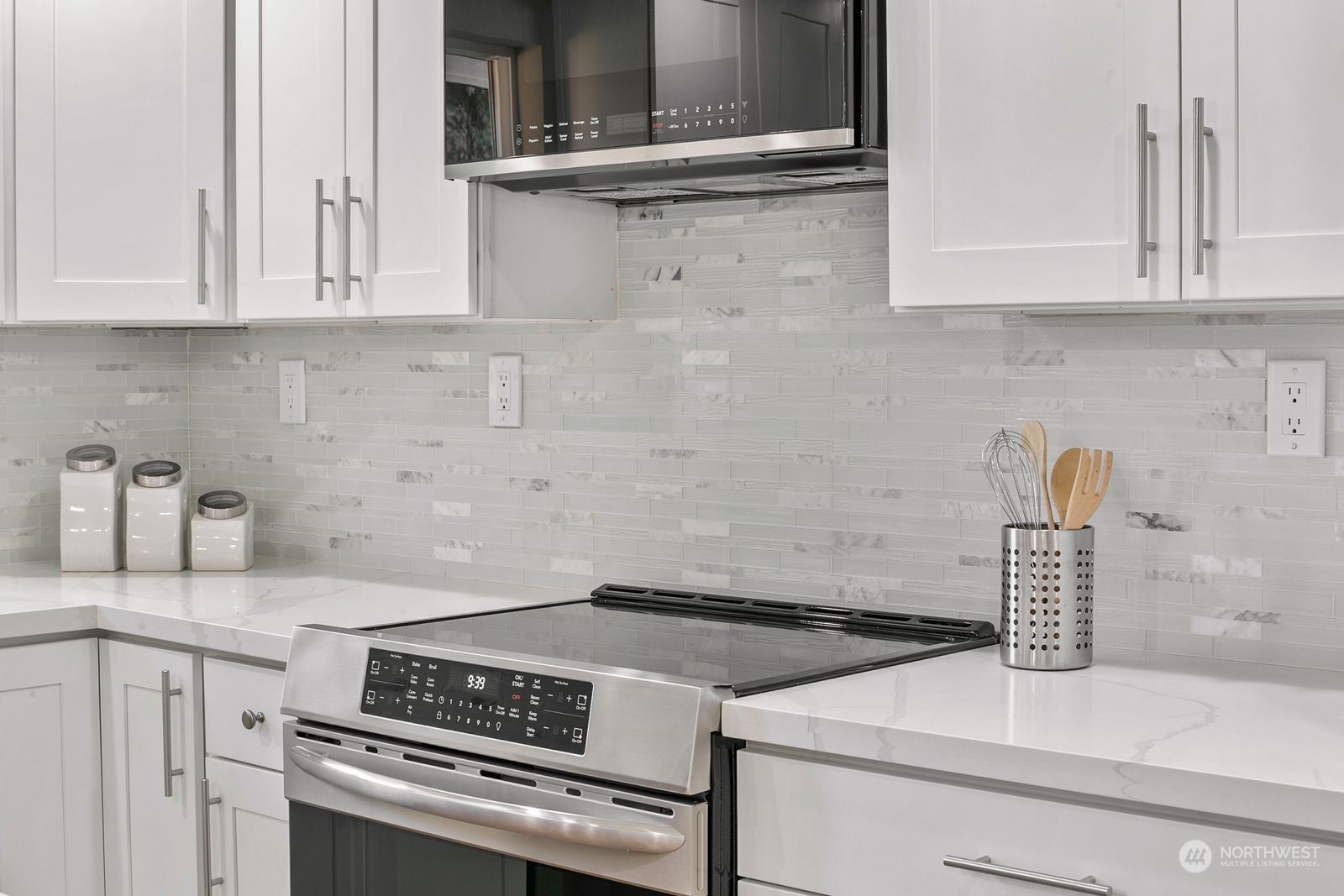 10809 Rustic Road South Seattle, WA 98178 - Photo 13 of 30 a kitchen with granite countertop a stove and a sink