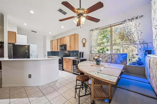 a utility room with cabinets washer and dryer