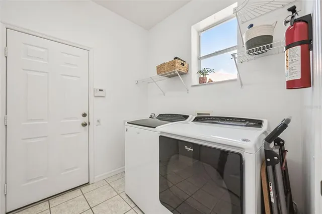 a view of a livingroom with furniture and workspace