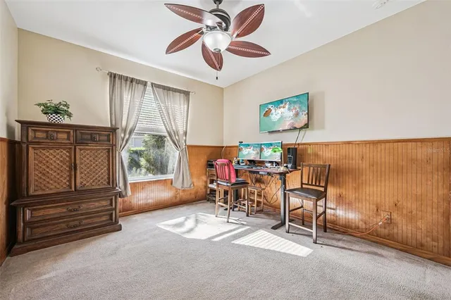a bedroom with furniture and a window