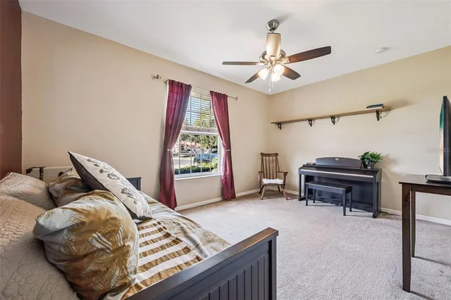 a bed room with a bed and a chair