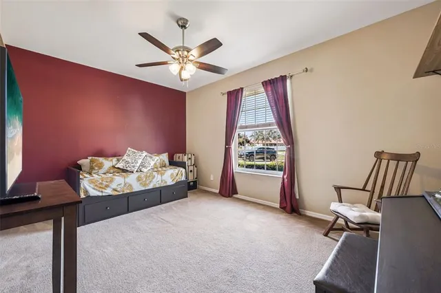 a living room with furniture and a piano