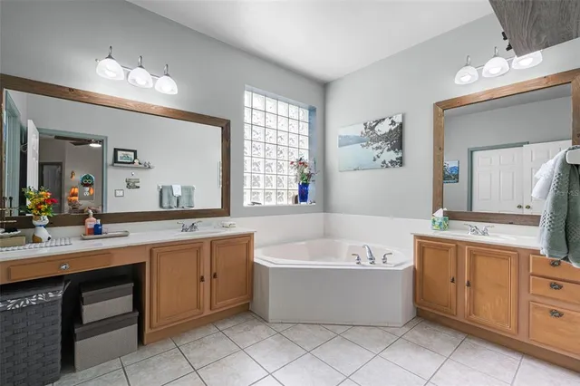 a view of a hallway with closet and a living room