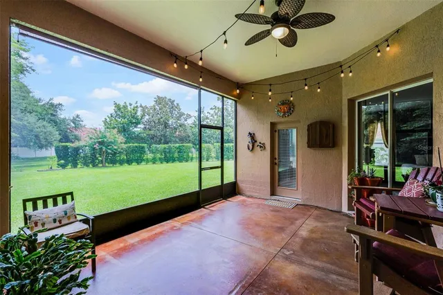 a backyard of a house with table and chairs