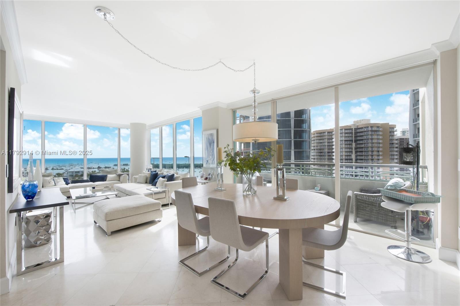 3400 Southwest 27th Avenue, Unit 1003 Coconut Grove, FL 33133 - Photo 2 of 18 a living room with furniture and a large window