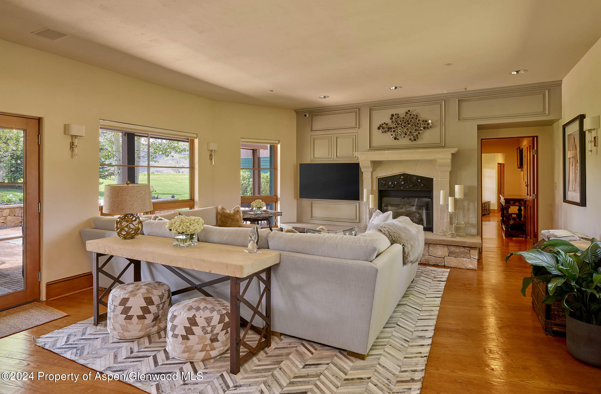910 White Star Drive Aspen, CO 81612 - Photo 14 of 66 a living room with furniture a table and a fireplace