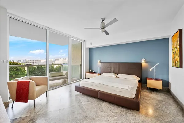 a bedroom with furniture and a bed