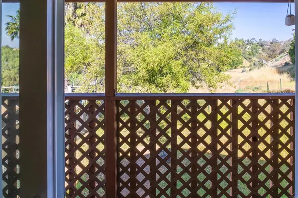 a view of a balcony with wooden floor