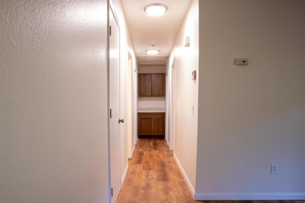 2319 Ridgeway Drive National City, CA 91950 - Photo 4 of 26 a view of a hallway with wooden floor