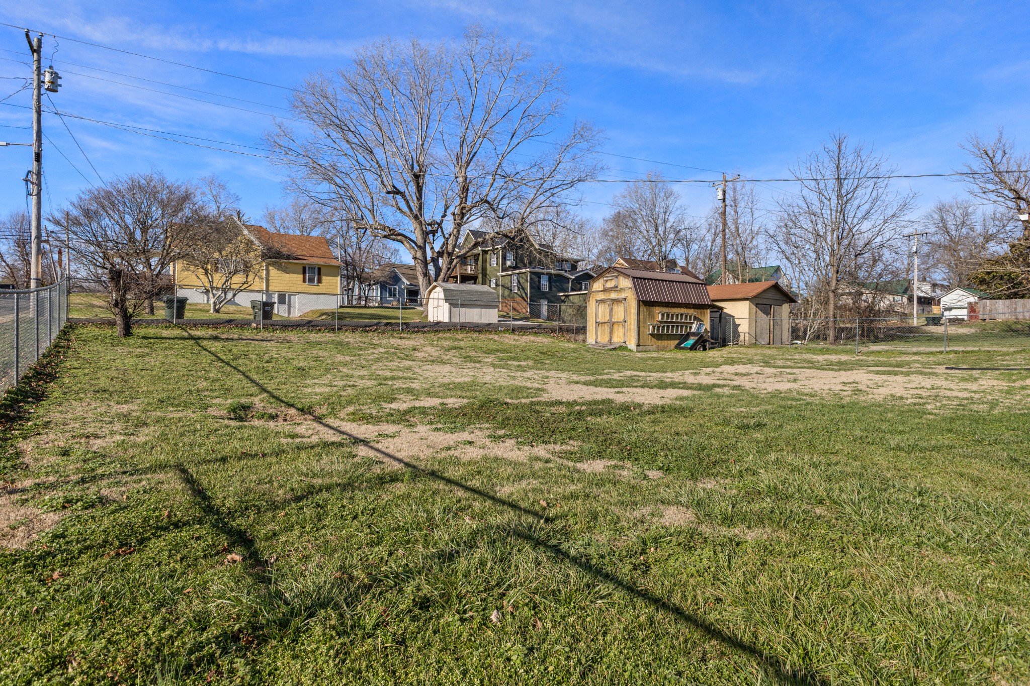 406 High Street Dickson, TN 37055 - Photo 14 of 24 a sign board with yard in the back